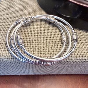 Coiled silver artisan bangle bracelet